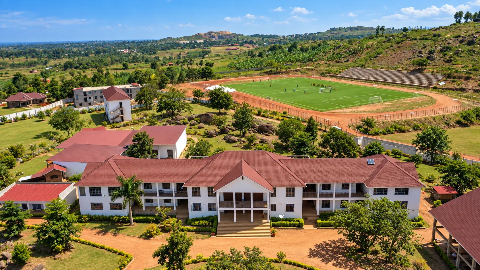 Aerial panorama of Amus College School buildings and sports facilities