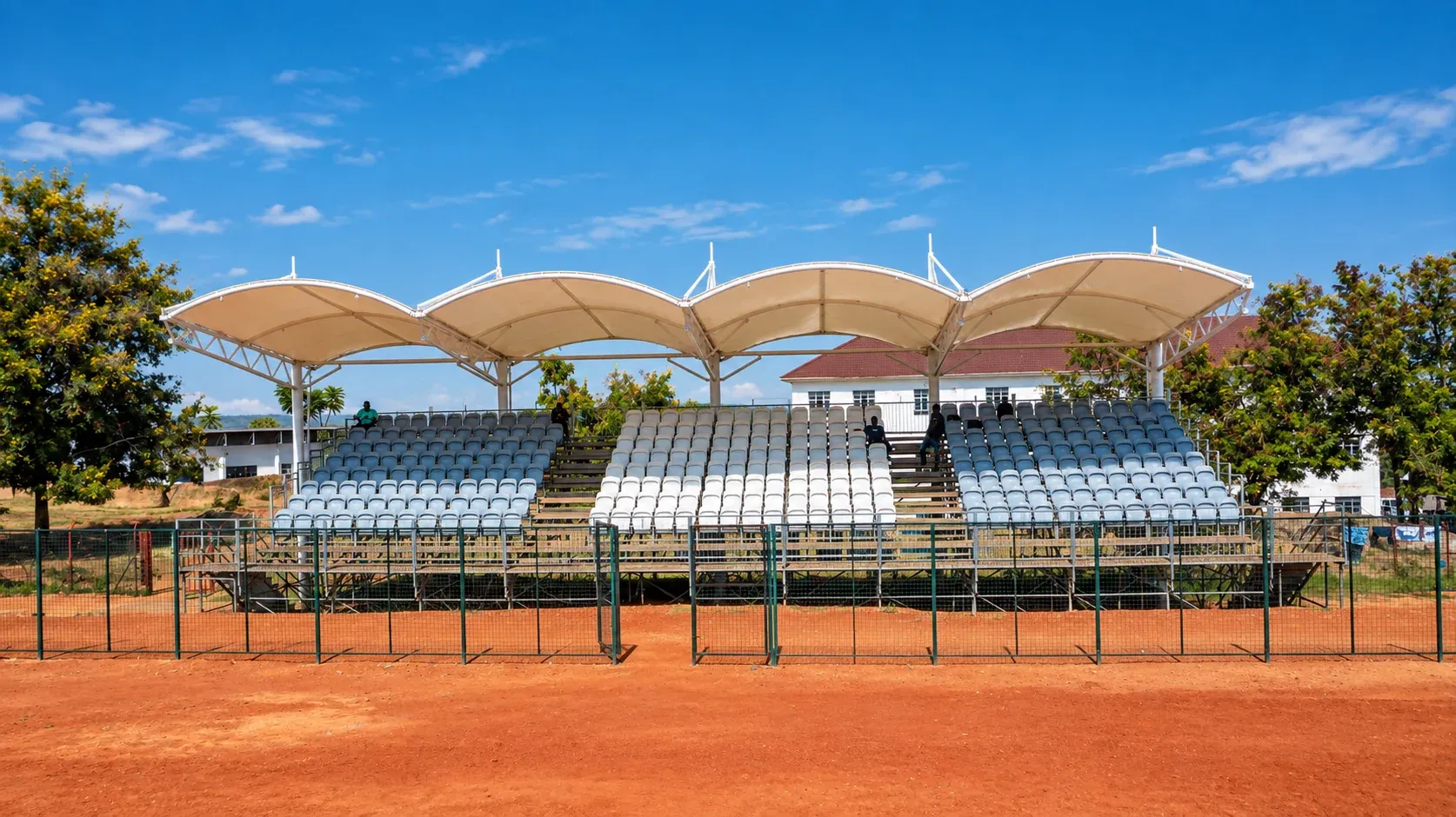 Covered spectator grandstand at the Amus College School sports field