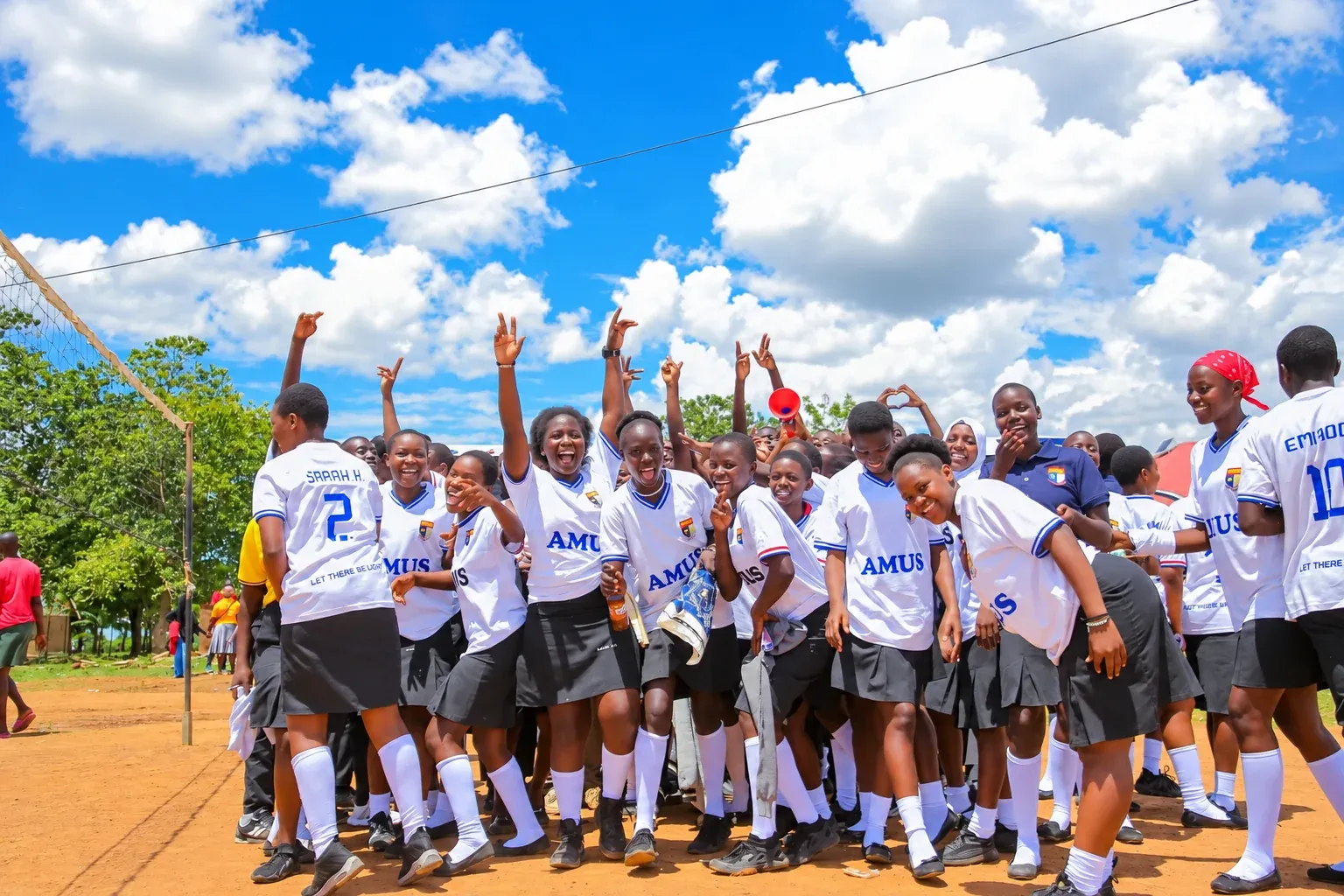 Amus College School students celebrating together during a school activity