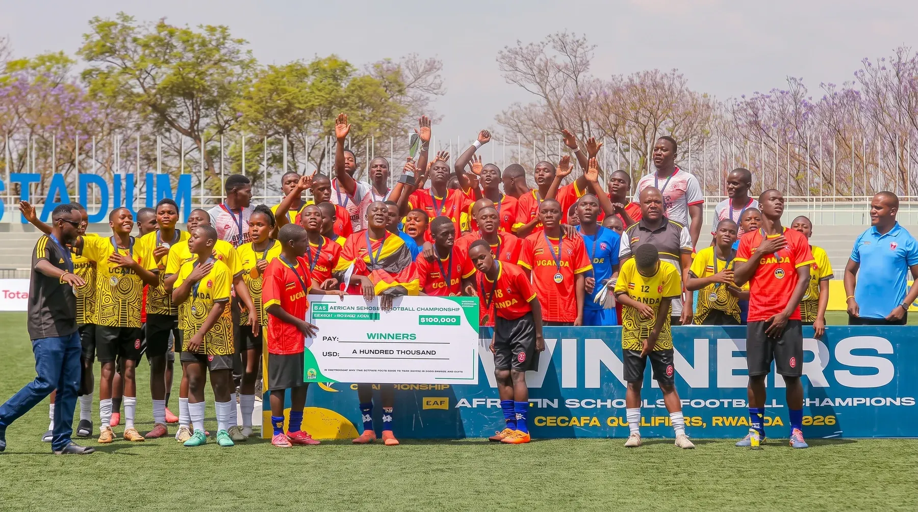 Amus College School boys' and girls' teams celebrating after the CECAFA CAF African Schools Football Championship qualifiers in Kigali, Rwanda, in 2026.