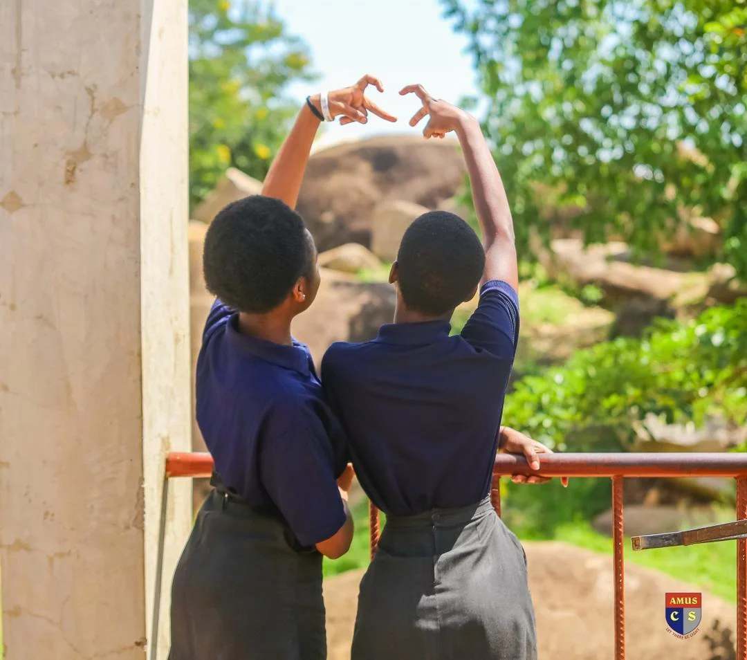 Students facing rocks